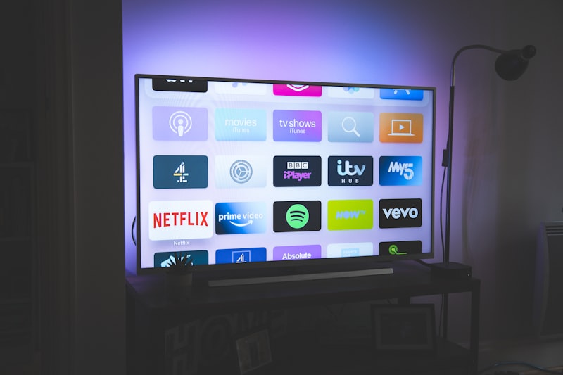 Smart TV displaying streaming apps in a modern dark living room