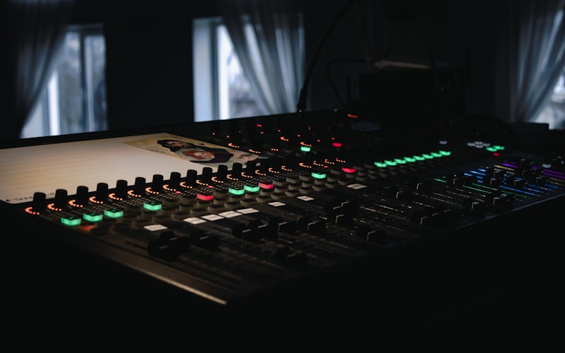 Professional audio mixing board with illuminated controls